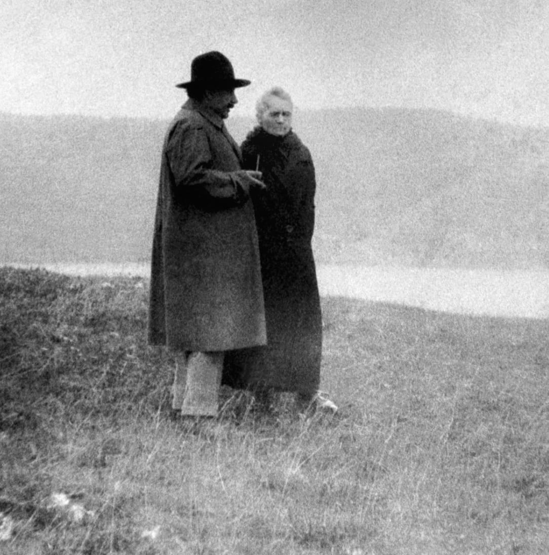 Albert Einstein and Marie Curie near a lake in 1929, Photo Credit: AIP Emilio Segrè