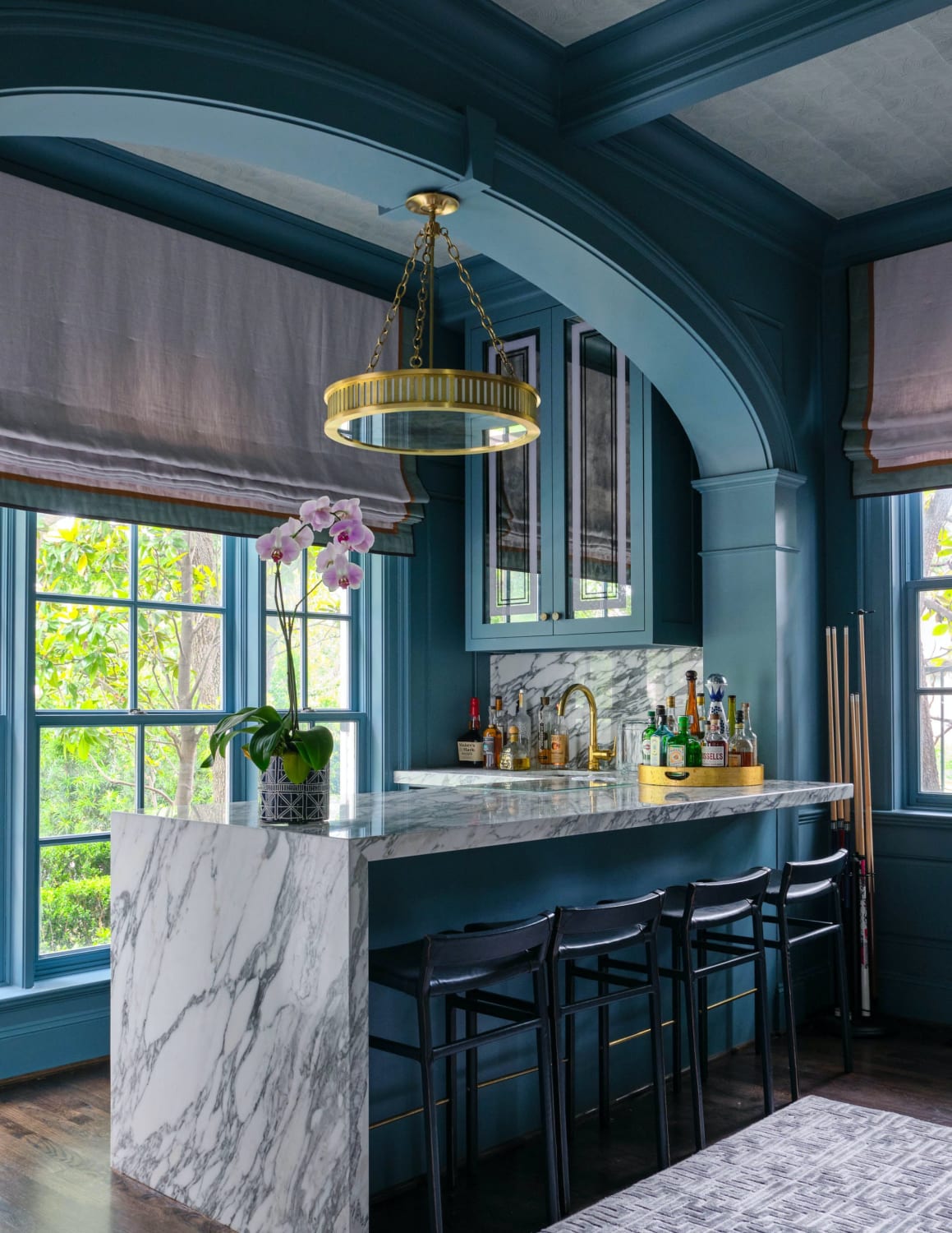Seated home bar with glass front cabinets in a Dallas home, Texas