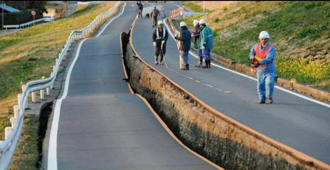 Road getting perfectly cut in half after earthquake in Japan.
