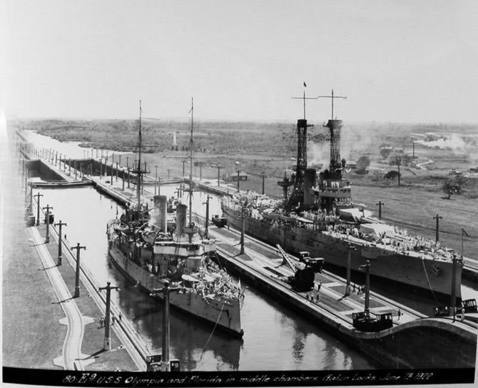 American warships USS Olympia and USS Florida passing through the Panama Canal locks: