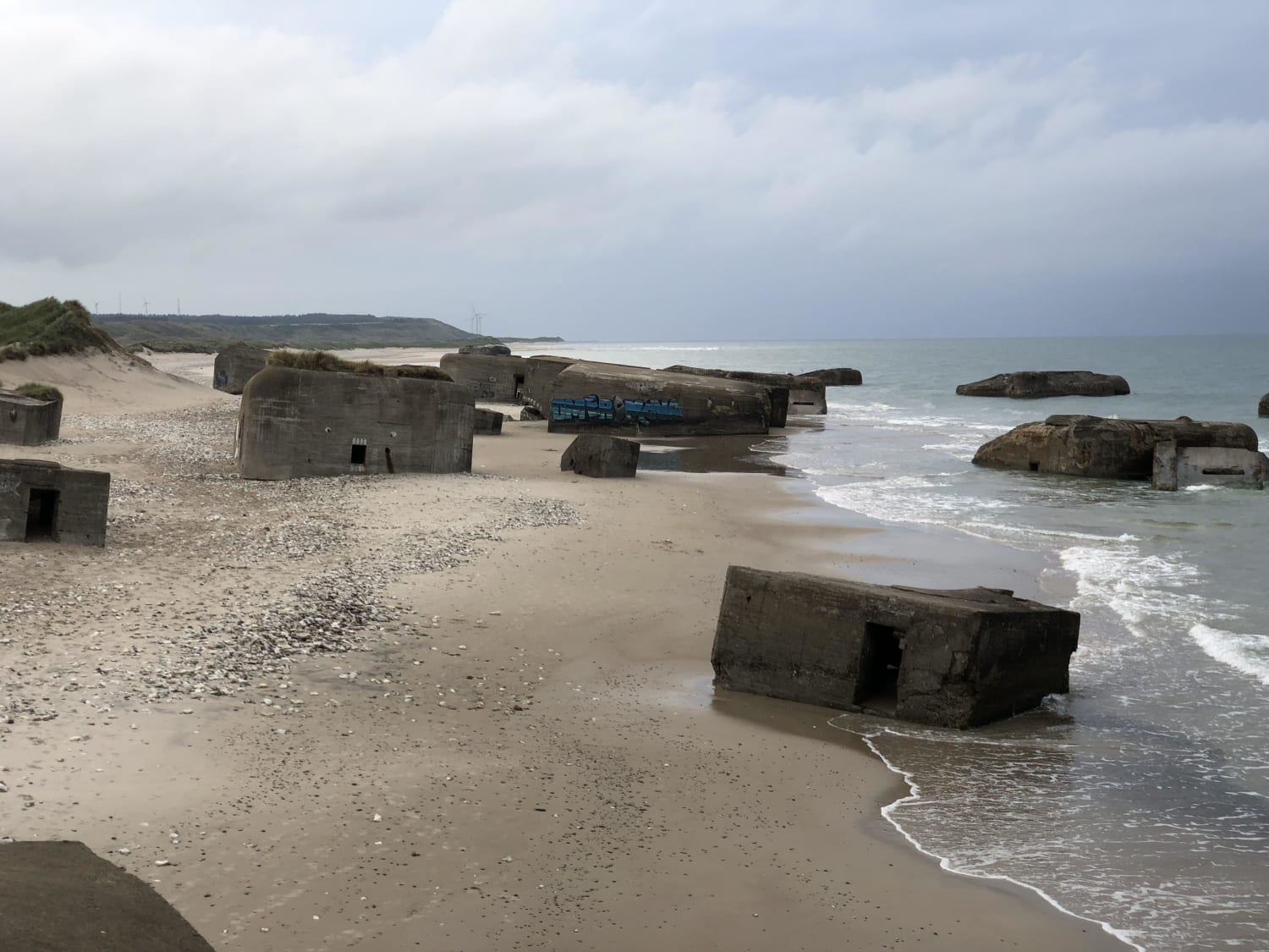 Nazi bunkers in Vigsö Denmark. Built in 1941 as a part of the Atlantic Wall. You can crawl around inside and climb up through a few. The sea is slowly claiming them.