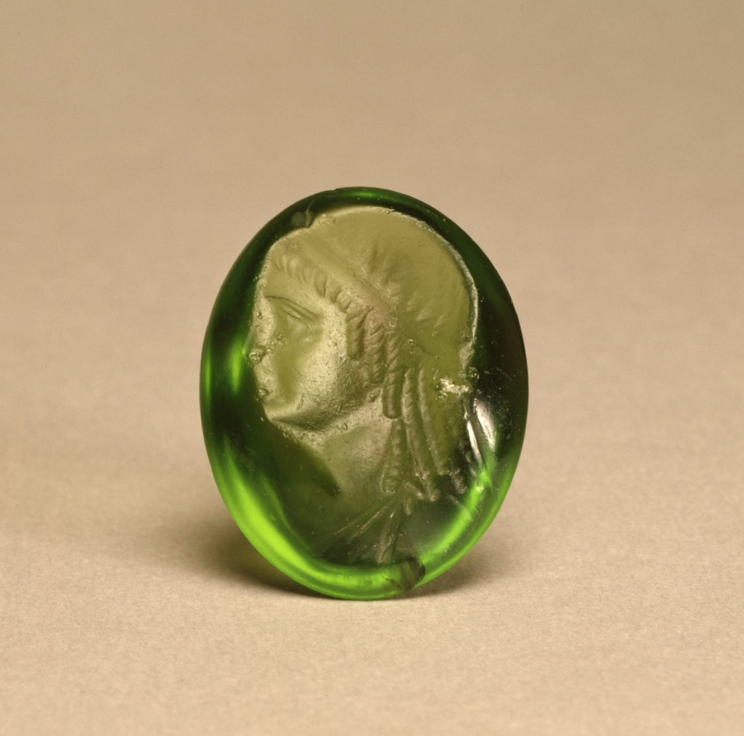 Ancient Greek-Egyptian (Hellenistic-Ptolemaic) carved peridot intaglio portrait of Cleopatra II, c. 175-115 BCE.