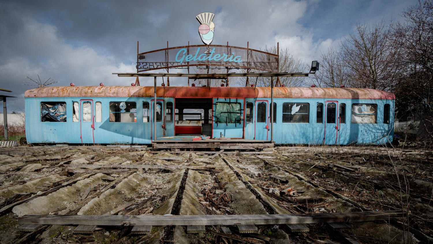 Old train car ice cream diner left on the side of the road to rot in south Belgium [oc]