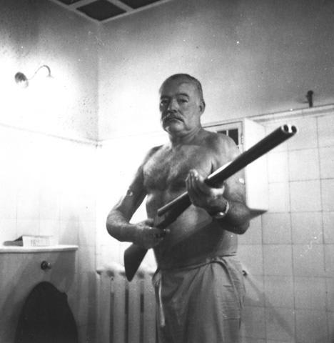 Ernest Hemingway, brandishing his 12-gauge Scott, late spring 1952.