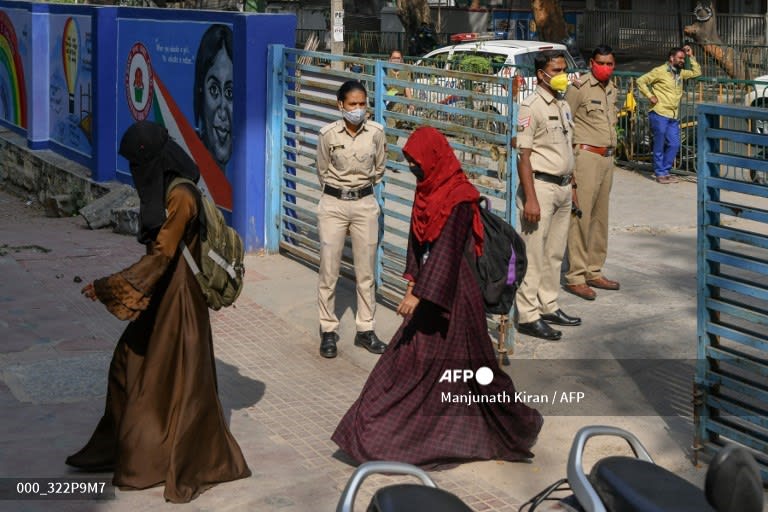 Security tight in India as schools reopen after headscarf row.