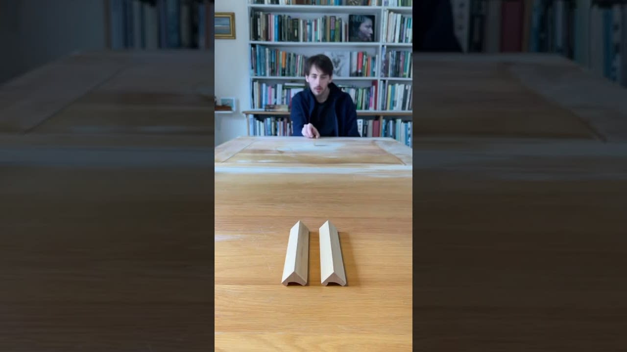 Guy Rolls Coins on Table Into Multiple Things - 1316558-1