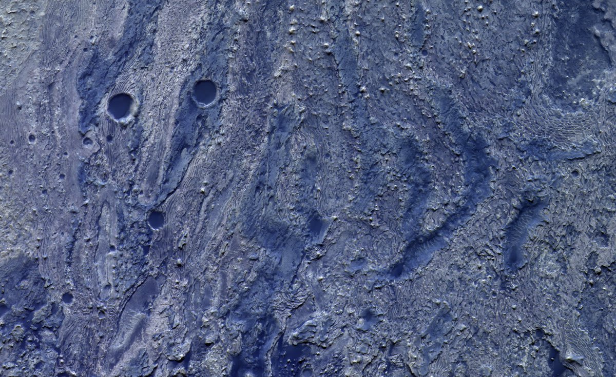This false-colour image from the ESA/Roscosmos ExoMars Trace Gas Orbiter @ESA_TGO, taken on 21 April 2021, shows detail in layered deposits exposed on the floor of a 50 km wide impact crater in the Meridiani Planum region of Mars