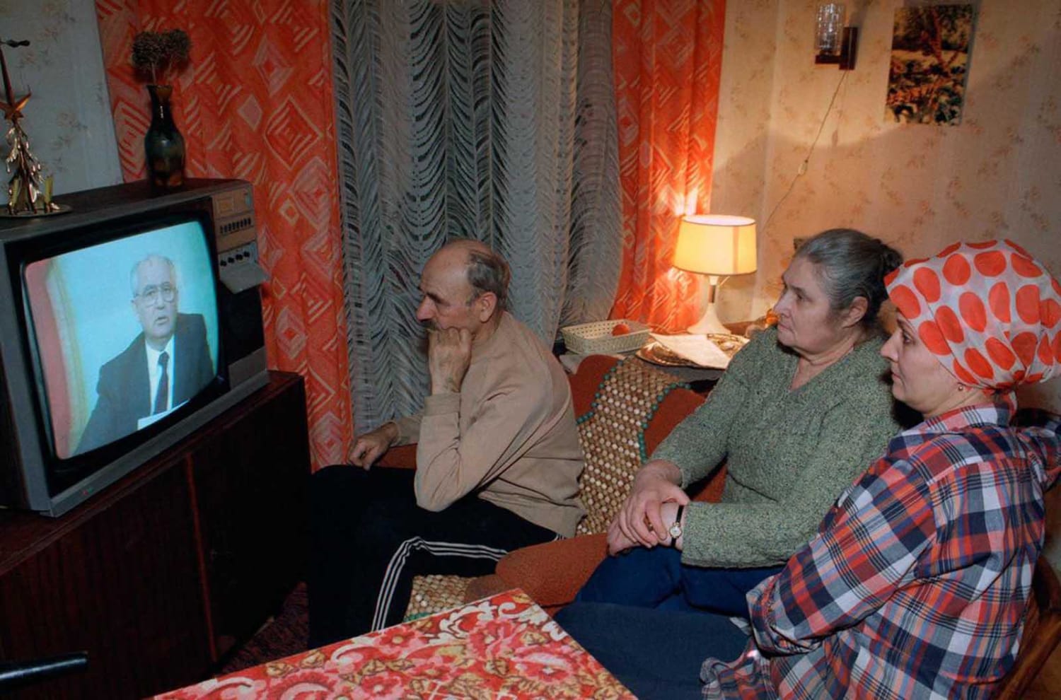 Family watches Soviet President Mikhail Gorbachev’s resignation speech on television, 1991