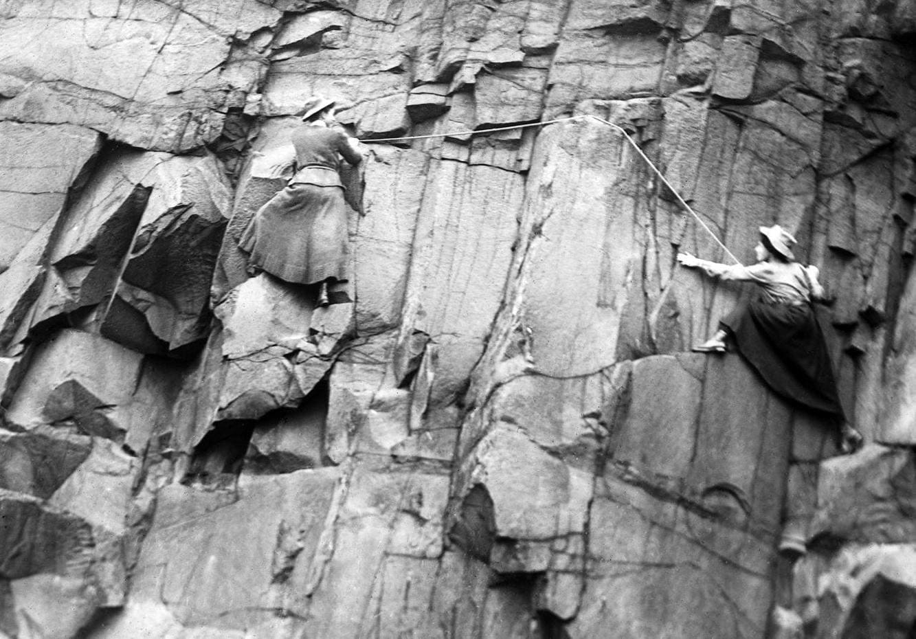 Lucy Smith and Pauline Ranken of the Ladies Scottish Climbing Club, climbing the Salisbury Crags cliff in Edinburgh. 1908.
