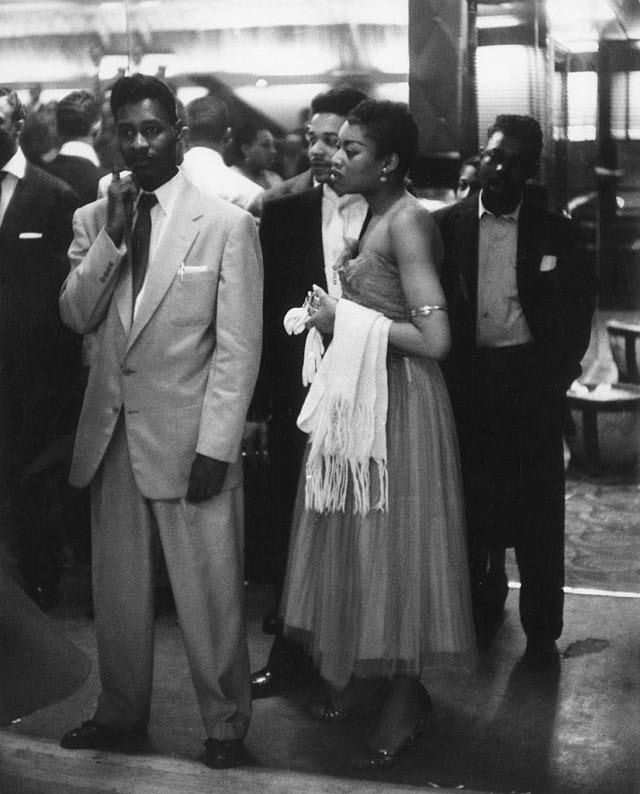 Young people waiting to enter the Savoy dance hall in Harlem, 1956. Photograph by Mario De Biasi.