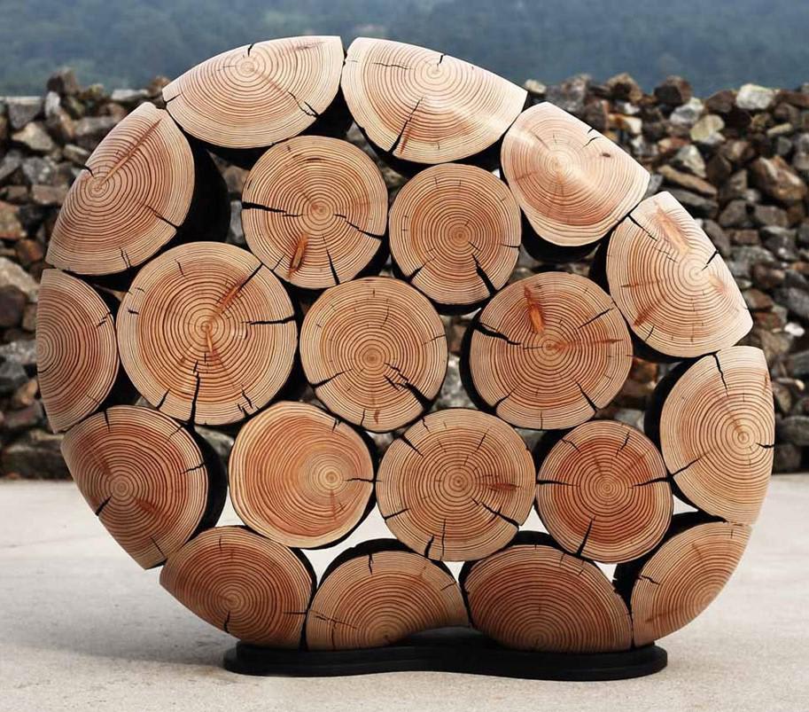 Art sculpture by South Korean artist Jae-Hyo Lee made from discarded tree trunks and branches.