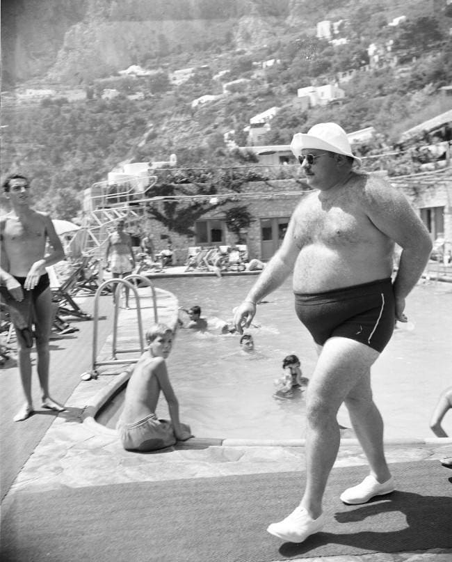 Egypt's exiled King Farouk shows off his curves. Capri, Italy 1953