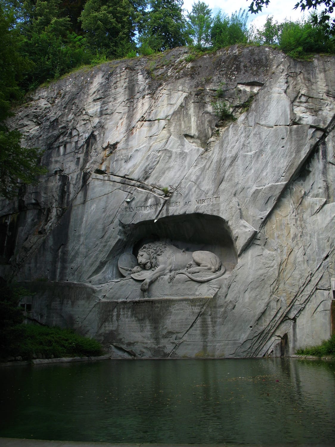 The Lion of Lucerne is a rock relief in Lucerne Switzerland designed by Bertel Thorvaldsen and hewn in 1820-21 by Lukas Ahorn