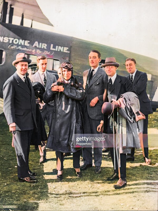 English comic actor Charlie Chaplin (in coat and goggles) prepares to board an Instone Airlines Vickers Vimy airplane that will take him from Croydon, London, to Paris, France on his way back to Hollywood. He is one of the first film stars to take a commercial flight.