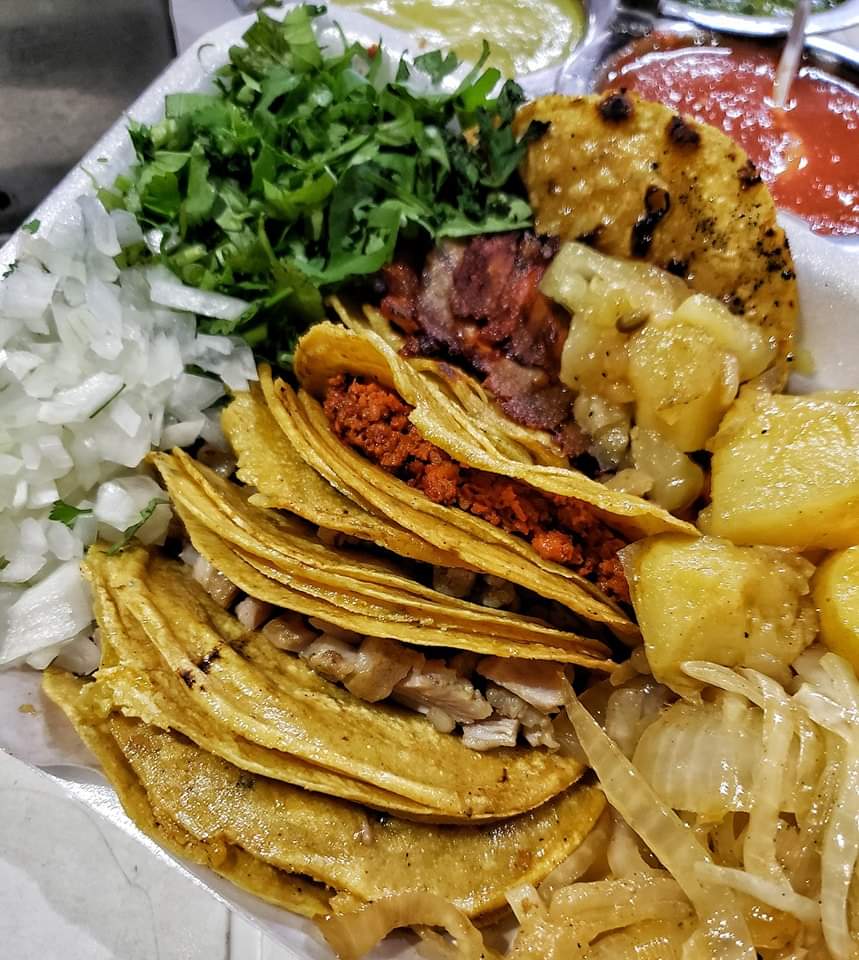 Amazing Street Mexican food: Chorizo, tripa and Al pastor tacos.