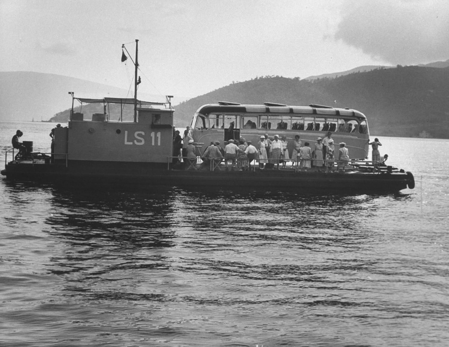 A ferry crossing the Bay of Kotor carrying tourists (Kotor, Yugoslavia 1957)