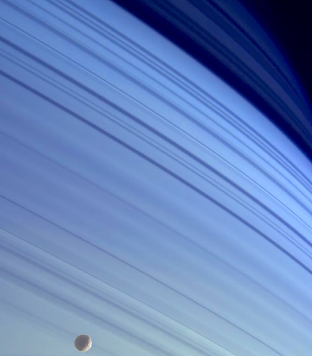 Iconic images of space No.35 This is the moon Mimas against the blue backdrop of Saturn taken by the NASA/ESA/ASI Cassini spacecraft on 18 January 2005
