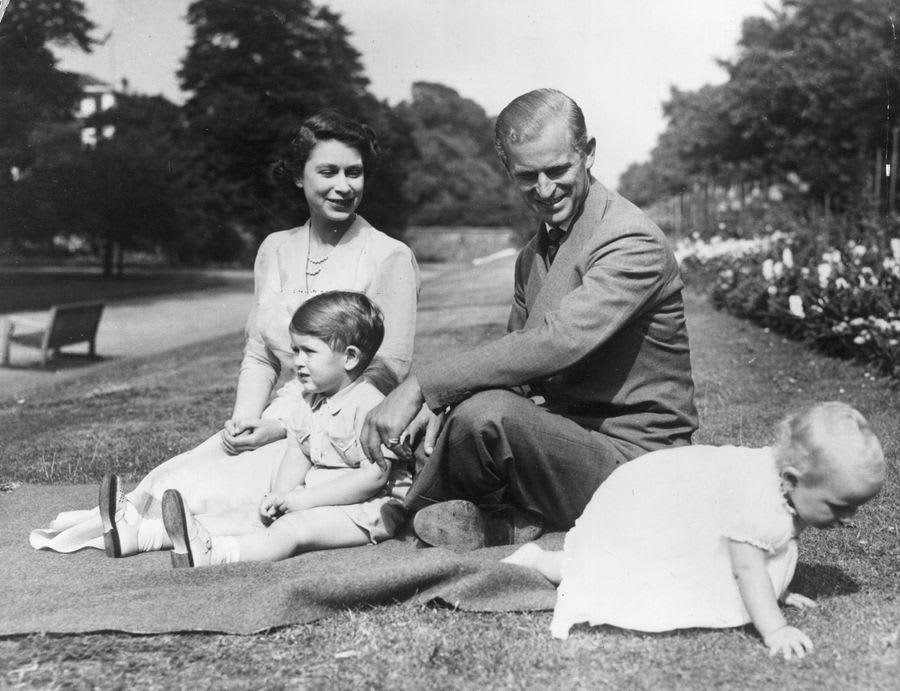 Queen Elizabeth and Prince Philip with their children, Prince Charles and Princess Anne, at Clarence House, 1951