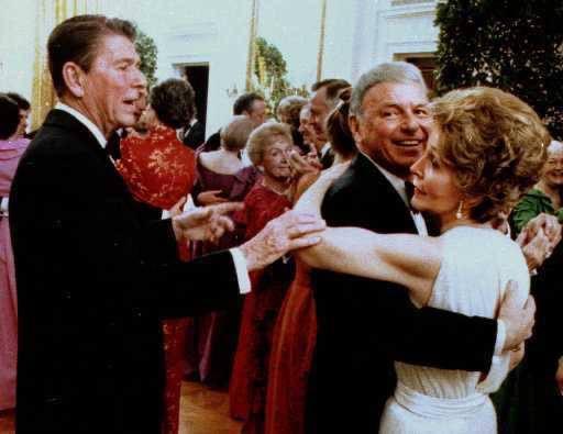 Frank Sinatra being told by the President to stop dancing with the First Lady, Nancy Reagan. (1981)
