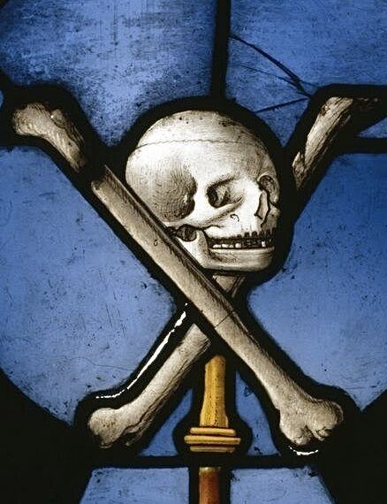 A skull and crossbones looms over the tumbling symbols of the church (inc. mitre, papal tiara, crosses) in this stained glass panel ‘Triumph of Death over the clergy’ From St Herbland, Normandy. c.1520-30 (@V_and_A)