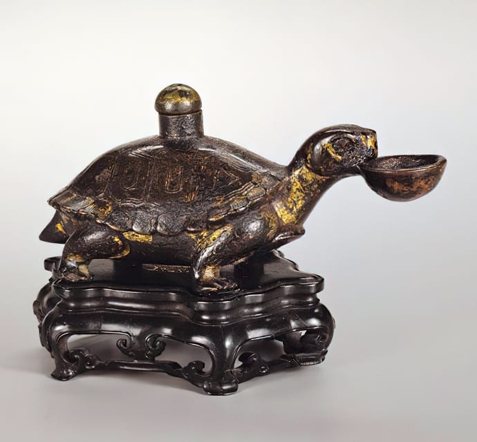 Water dropper shaped like a turtle holding a bowl in its mouth. China, Tang dynasty, 618-907 AD