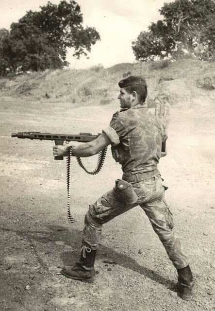 Portuguese soldier hip fires an MG-42 during the Portuguese colonial war,Mozambique(1961-74)