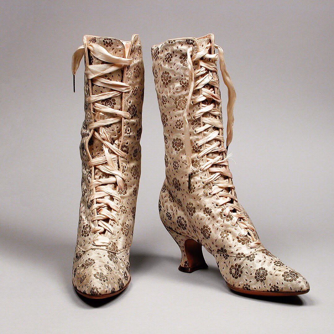 These two similar pairs of brocaded satin boots prove that decorative silks weren't just for gowns! Both circa 1889, via