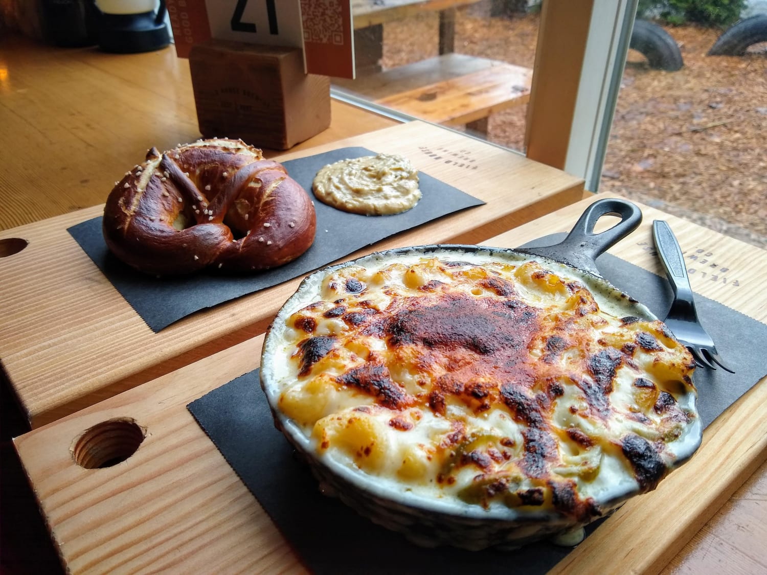 [I ate] Spicy mac n' cheese with Gruyere, Emmental and pickled peppers, and a soft pretzel