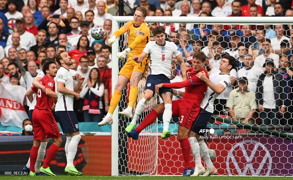 Euro2020 England's goalkeeper Jordan Pickford deflects a corner kick during the UEFA EURO 2020 semi-final football match between England and Denmark at Wembley Stadium in London.