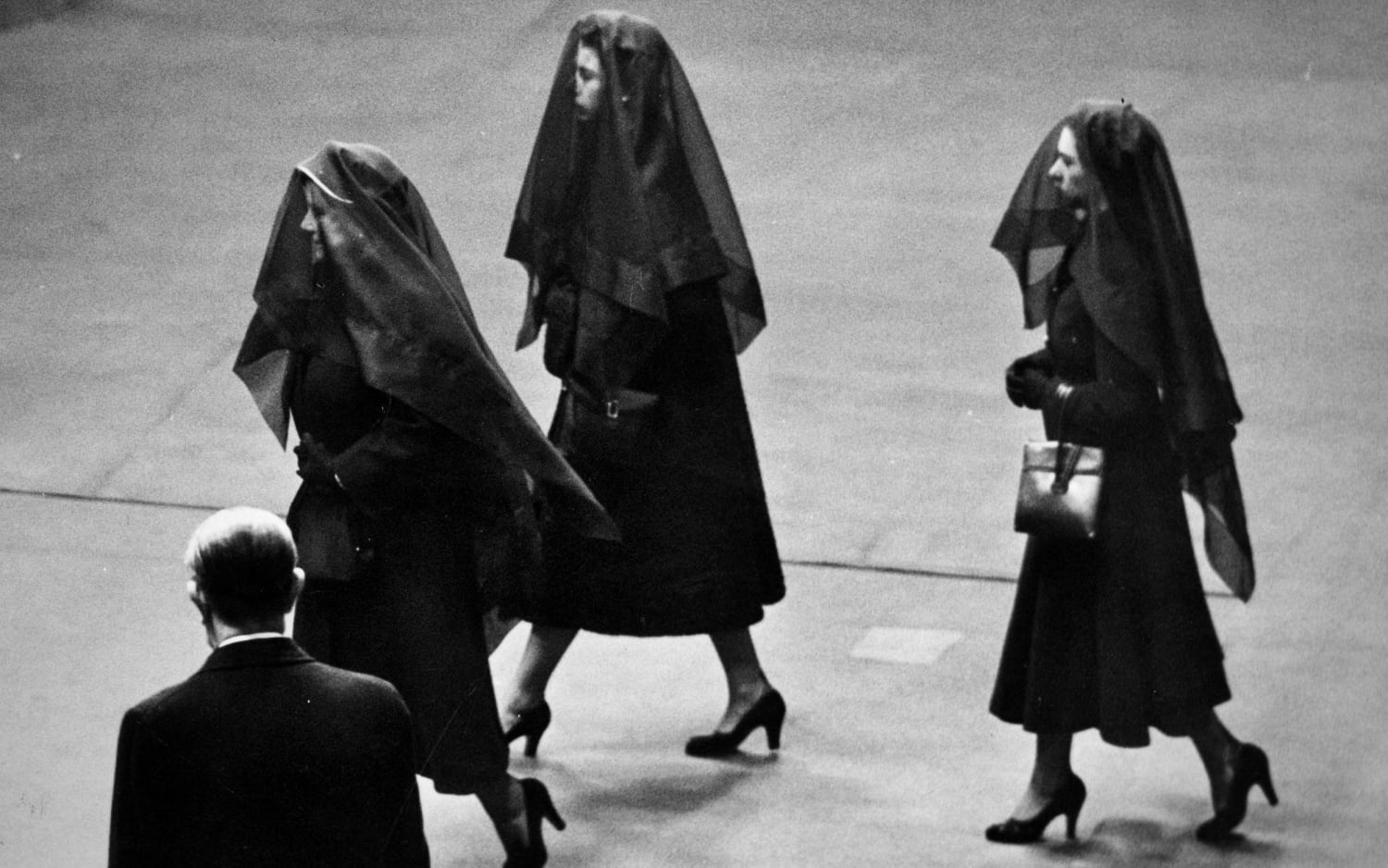 The Queen Mother, the new Queen Elizabeth II and Princess Margaret - veiled and in black for the funeral of King George VI. [15 February 1952 |