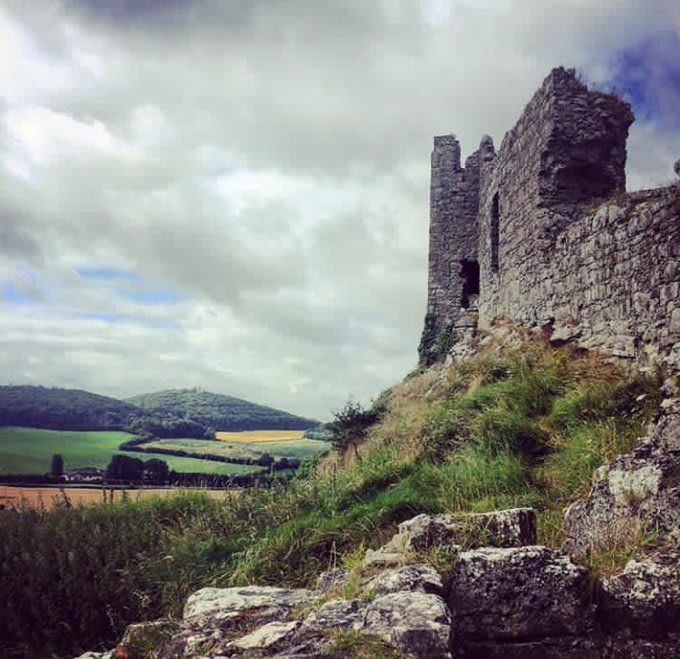 The medieval curtain wall enclosing the Rock of Dunamase, Laois. An excavation by Brian Hodkinson identified decapitated human skulls along the wall base & it appears that these had originally been impaled on the battlements, most likely as a warning to rebels and outlaws