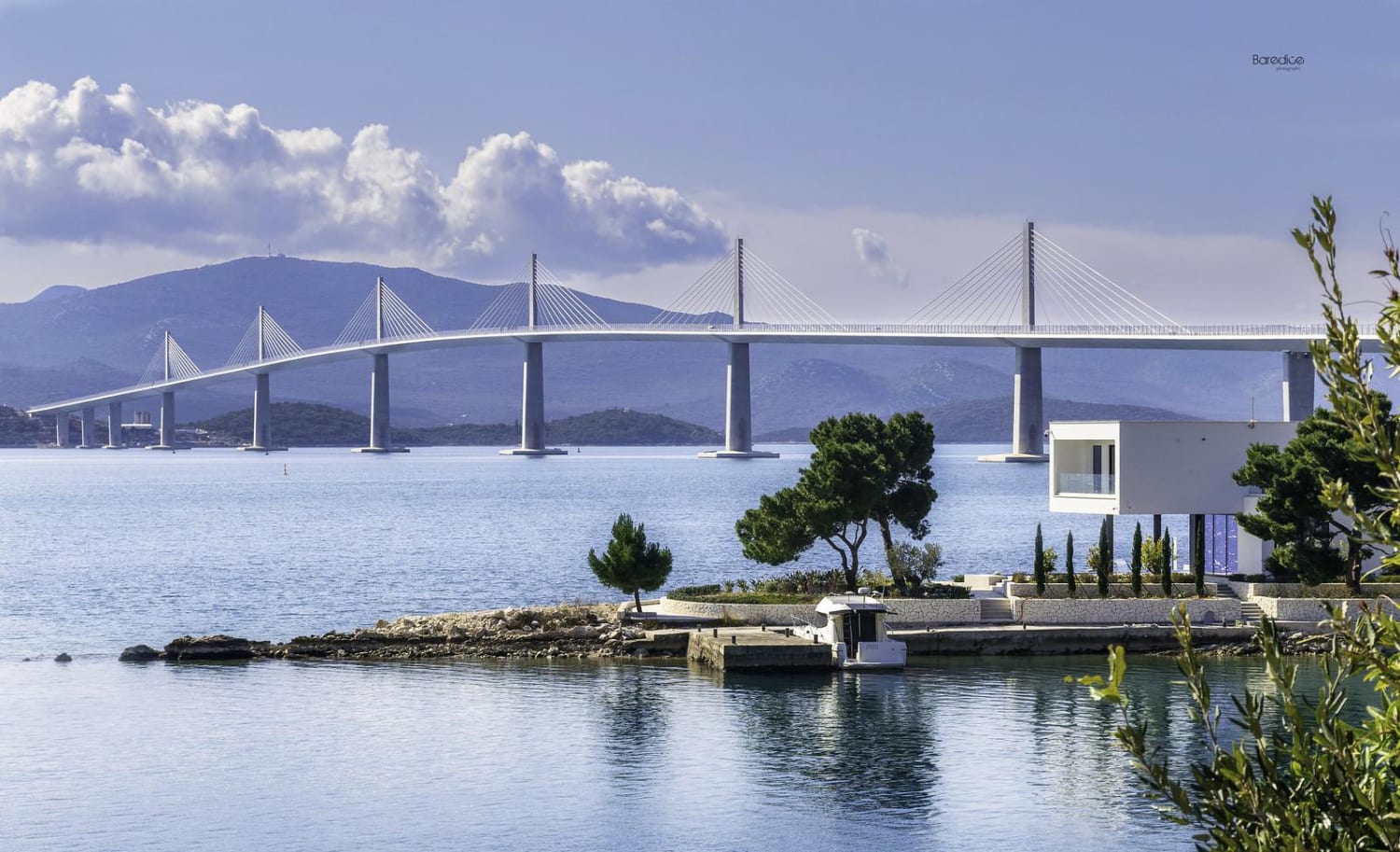 Modern villa with the Pelješac Bridge in the background, Croatia