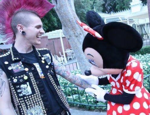 minnie mouse checking out a punk’s tattoos