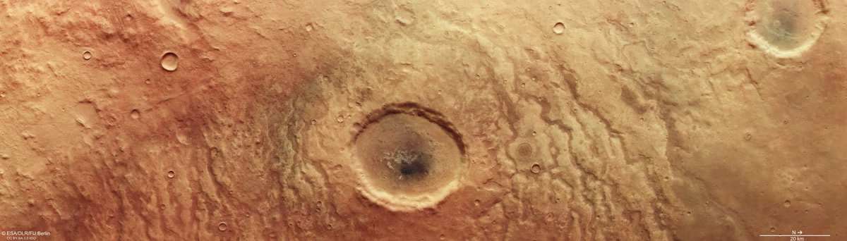 Our @esascience Mars Express mission captured this 30 km-wide crater nestled between winding channels on Mars - resembling veins running through a human eyeball 👁 The channels likely carried liquid water around 3.5–4 billion years ago! 👉https://t.co/sKbNxVAQxx