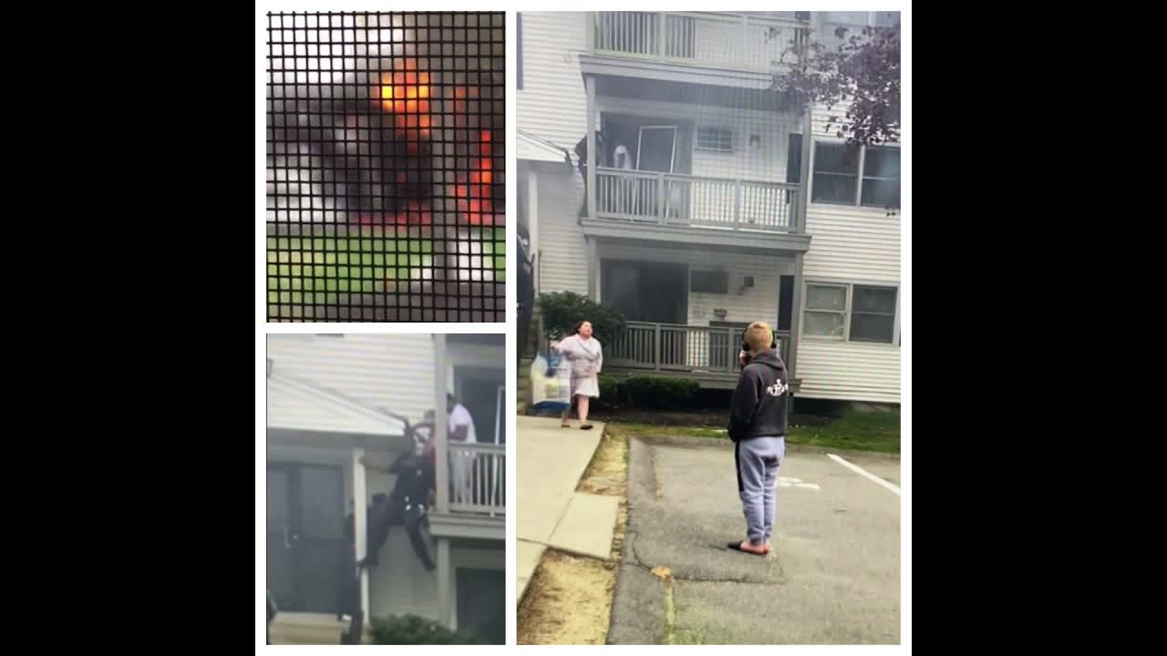 Fire that just happened in my city, good Samaritan and police officer help elderly woman to safety.