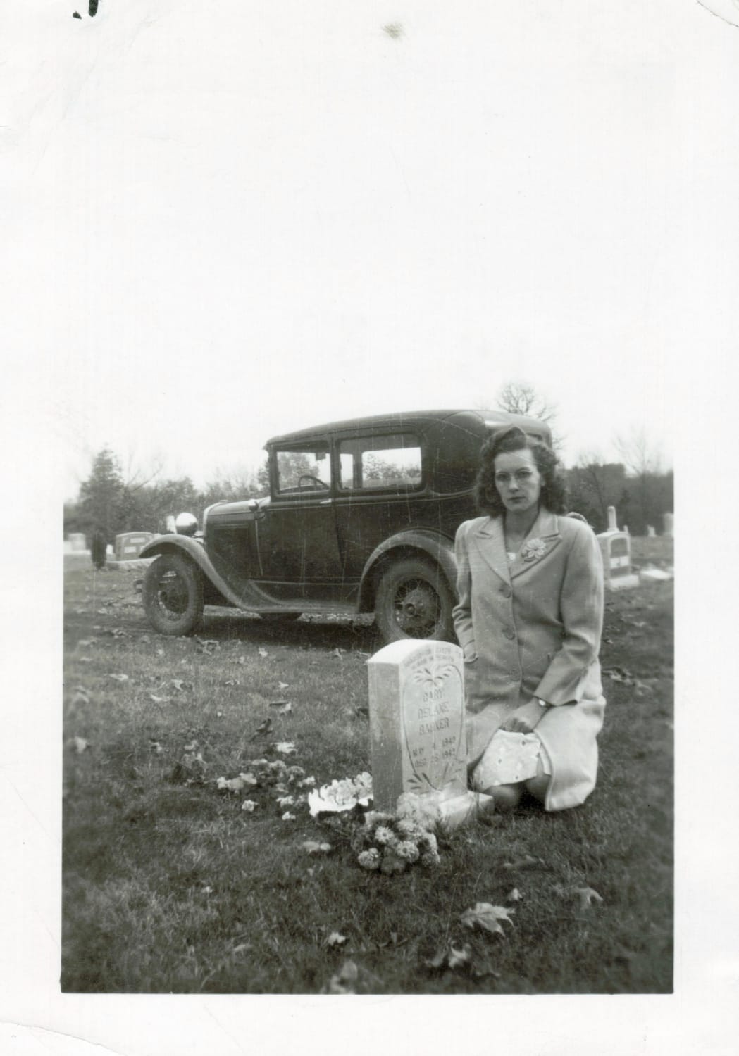 1943 - Edna May Baker at the grave of her deceased 7 month old son