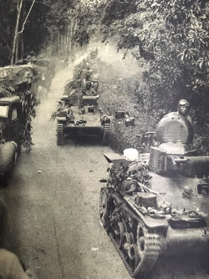 Japanese Type 97 Te-Ke tanks followed by bicycle infantry during the Battle of Kampar, Malaysia. 30 December 1941 – 2 January 1942