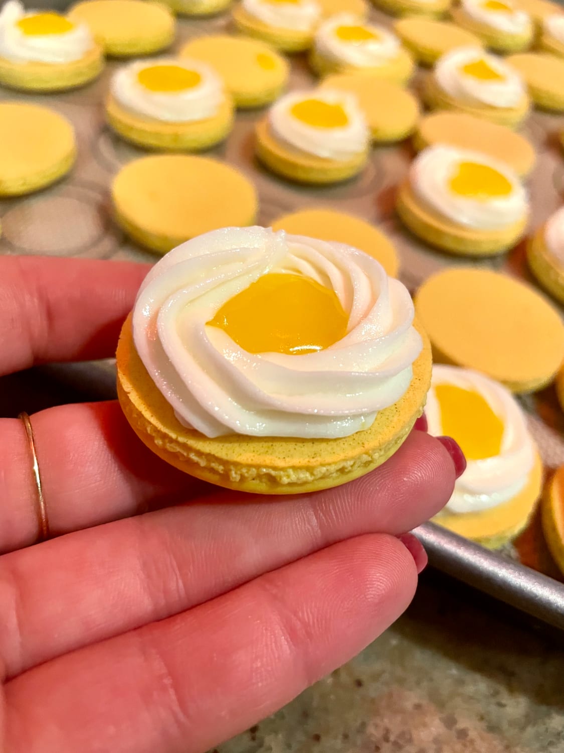[Homemade] Lemon macaron shells, lemon curd, & zesty vanilla buttercream!