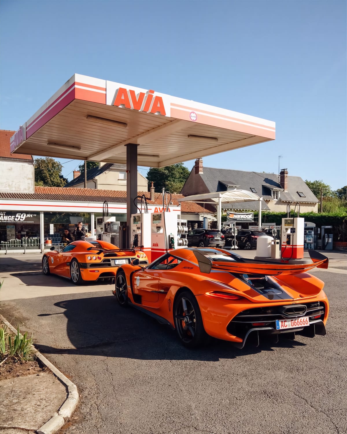 Orange Swedish Twins: Koenigsegg Jesko and CCXR at a gas station in Champagne, France! Do you prefer old or new Koenigsegg design?