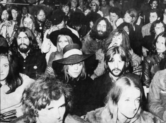 John Lennon, George Harrison, Ringo Starr and their wives watching Bob Dylan perform at the Isle of Wight Festival, 1969. (Paul and Linda didn't go because their daughter Mary was born the day before the festival started)