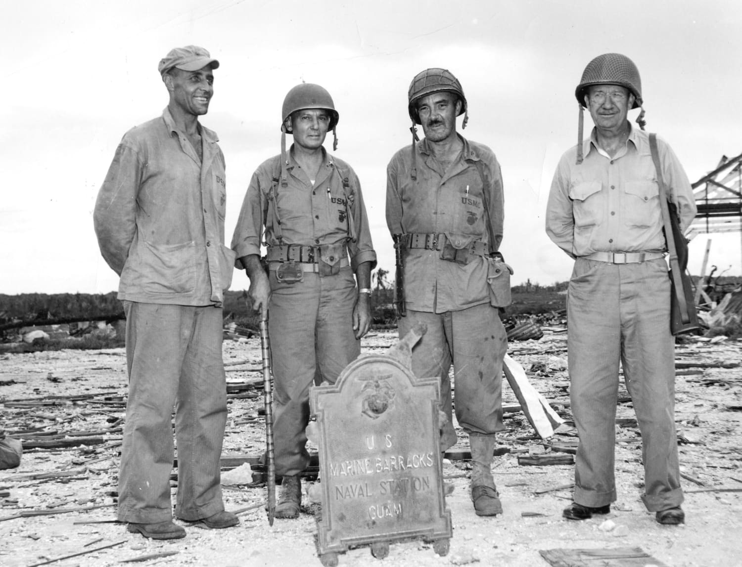 LTC. Alan Shapley (CO of 4th Marine Regiment), BGen. Lemuel C. Shepherd (CG of 1st Marine Provisional Brigade), Col. Merlin F. Schneider (CO of 22nd Marine Regiment) and Lt. Gen. Holland M. Smith following the recapture of Guam on August 10, 1944.