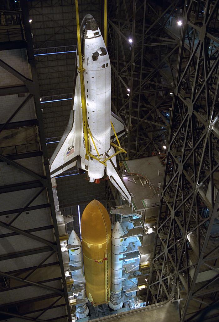 Ever wonder how space shuttles were connected/disconnected from those iconic orange stacks? Very carefully, with big cranes. This 1996 photo shows Atlantis from the 34th floor of the Vehicle Assembly Building as it is lifted away from its External Tank and solid rocket boosters.