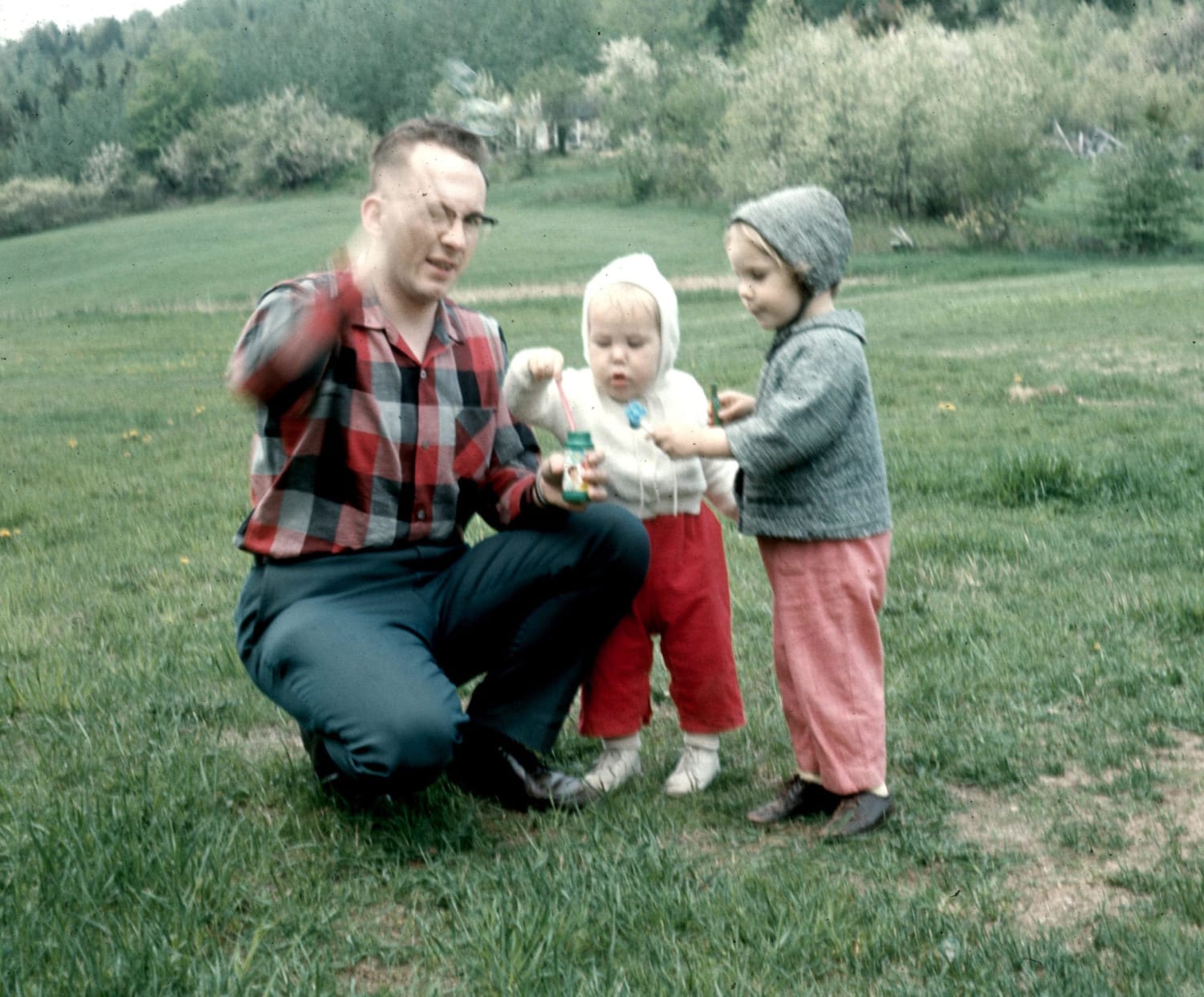Blowing Bubbles, 1966. My sister (age 3 in this pic) still lives on that land in a house built where the camp on the hill was.