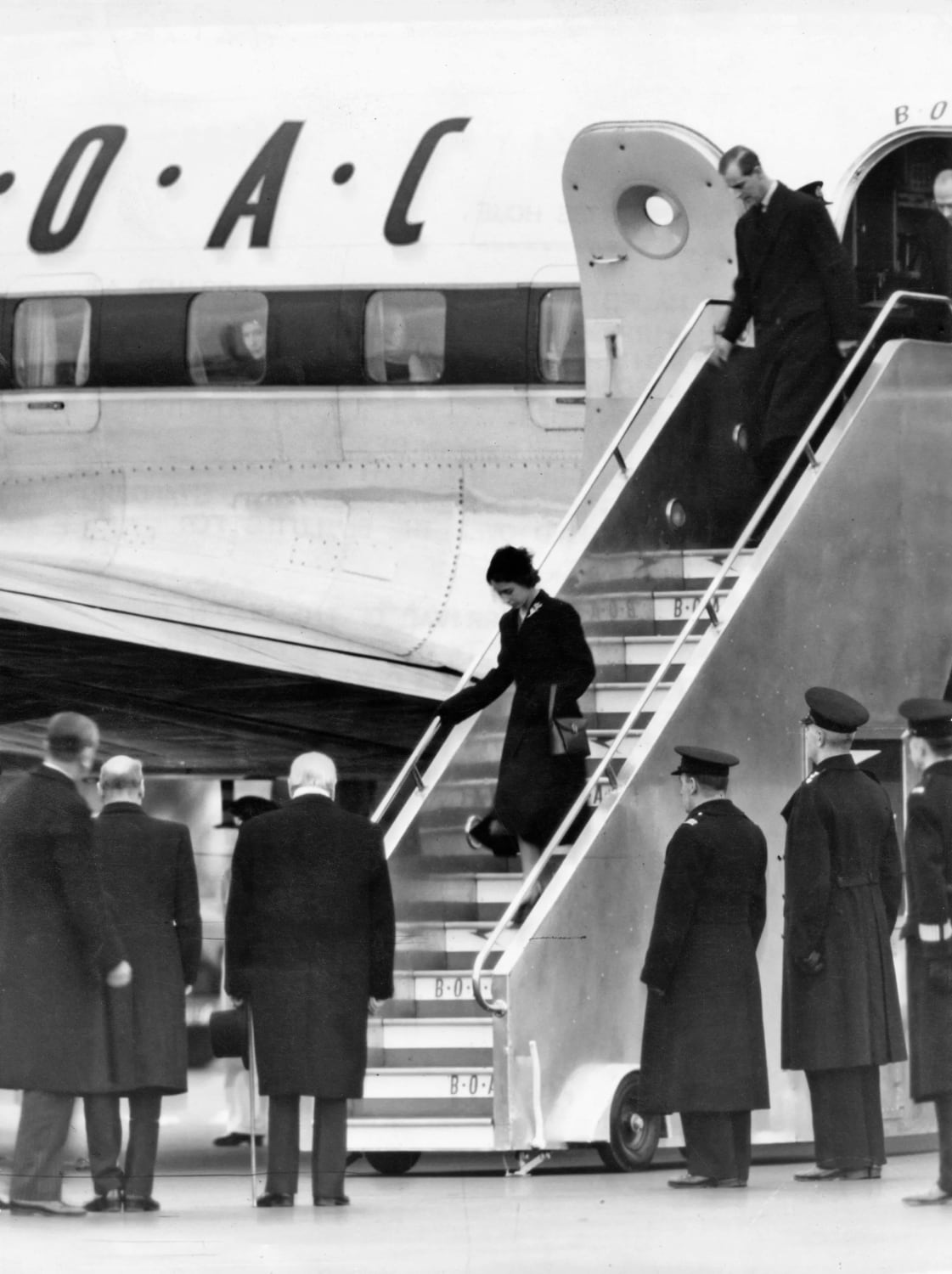 Princess Elizabeth sets foot in the United Kingdom for the first time as Queen Elizabeth II, arriving from Kenya at London Airport. Greeted amongst others by Winston Churchill and Clement Attlee. [February 7 1952 |