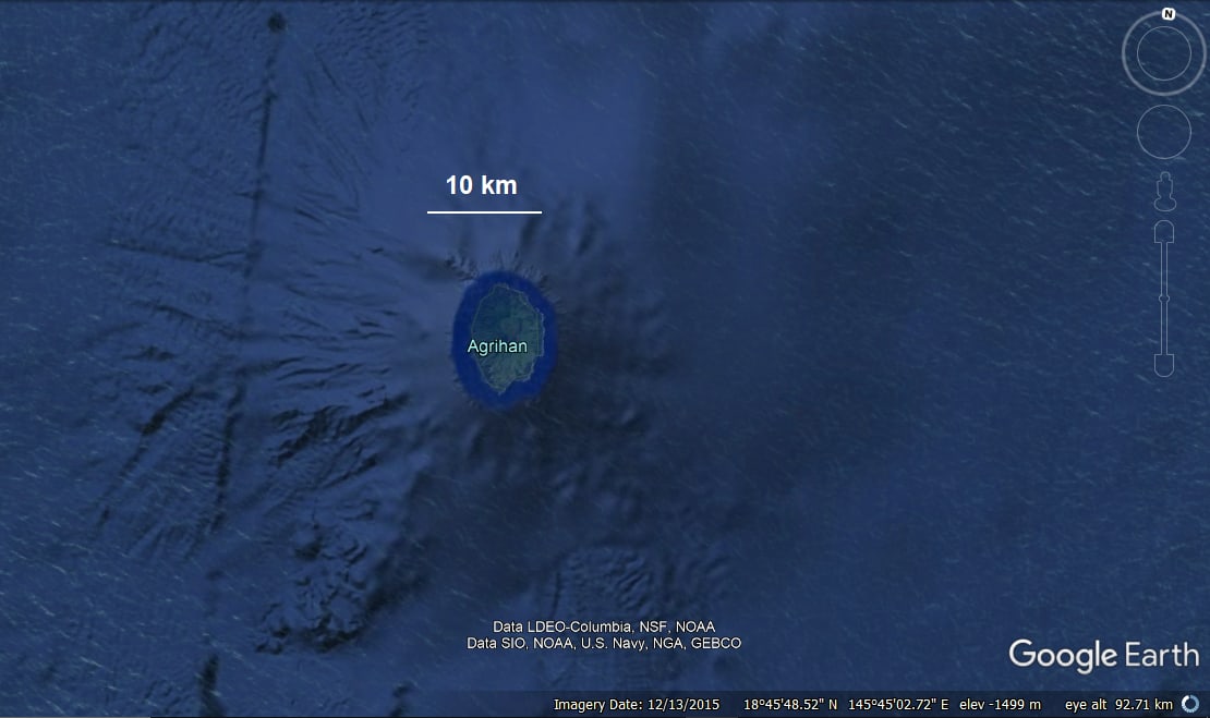 I was exploring around Google Earth when I found this. An obscure island, called Agrihan Island, located in the Western Pacific, is perched atop a giant underwater volcano. Coordinates are 18º45'48.52" N, 145º45'02.72" E.