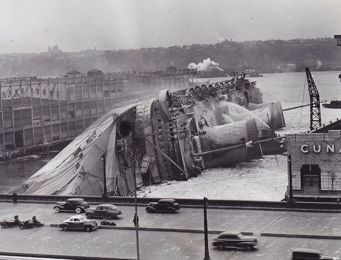 SS Normandie capsized and still burning in the Hudson River, New York 1942