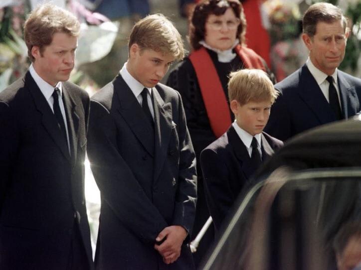 Earl Spencer, Prince William, Prince Harry, and Prince Charles looking at the hearse carrying Princess Diana’s coffin, September 6, 1997
