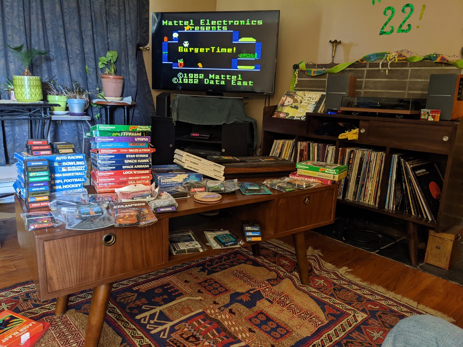 I pull out the Intellivision from time to time to enjoy my early childhood. I think the count is 50 with out duplicates. I made the coffee table and record cabinet to help create the retro vibe.