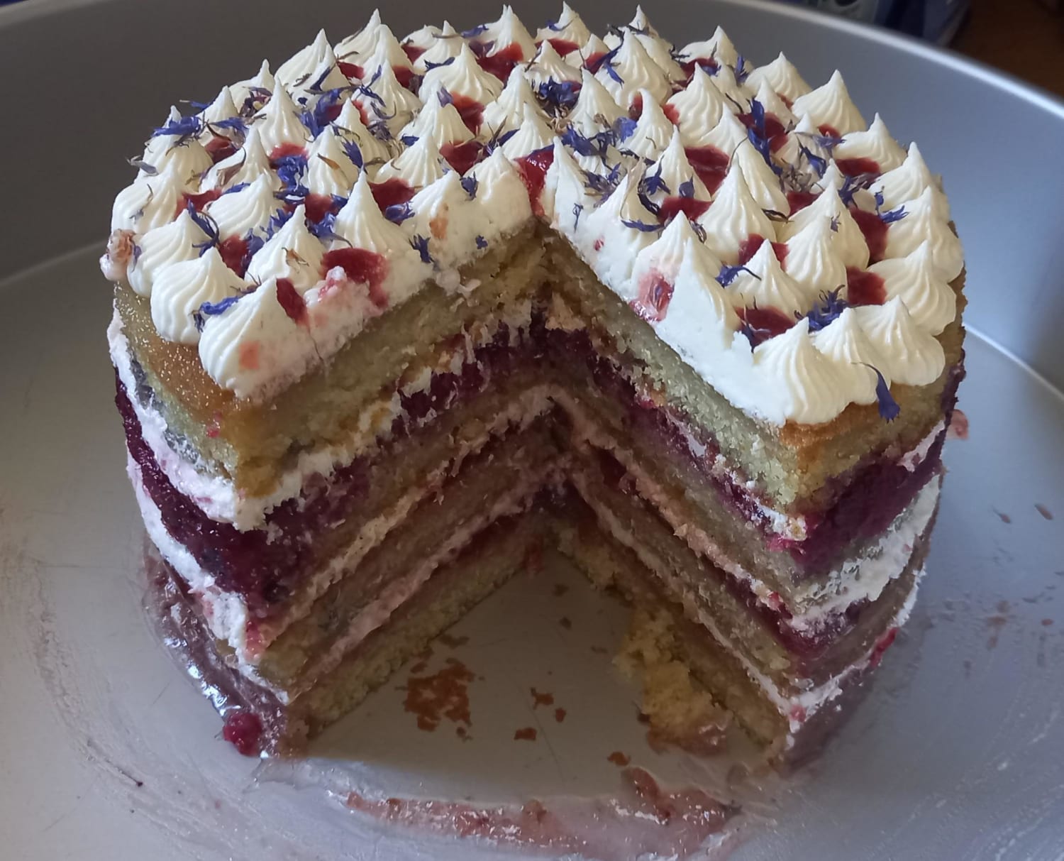 Victoria sponge kind of. vanilla sponge, strawberry jam, mixed berry compote, burnt strawberry sauce and milk frosting