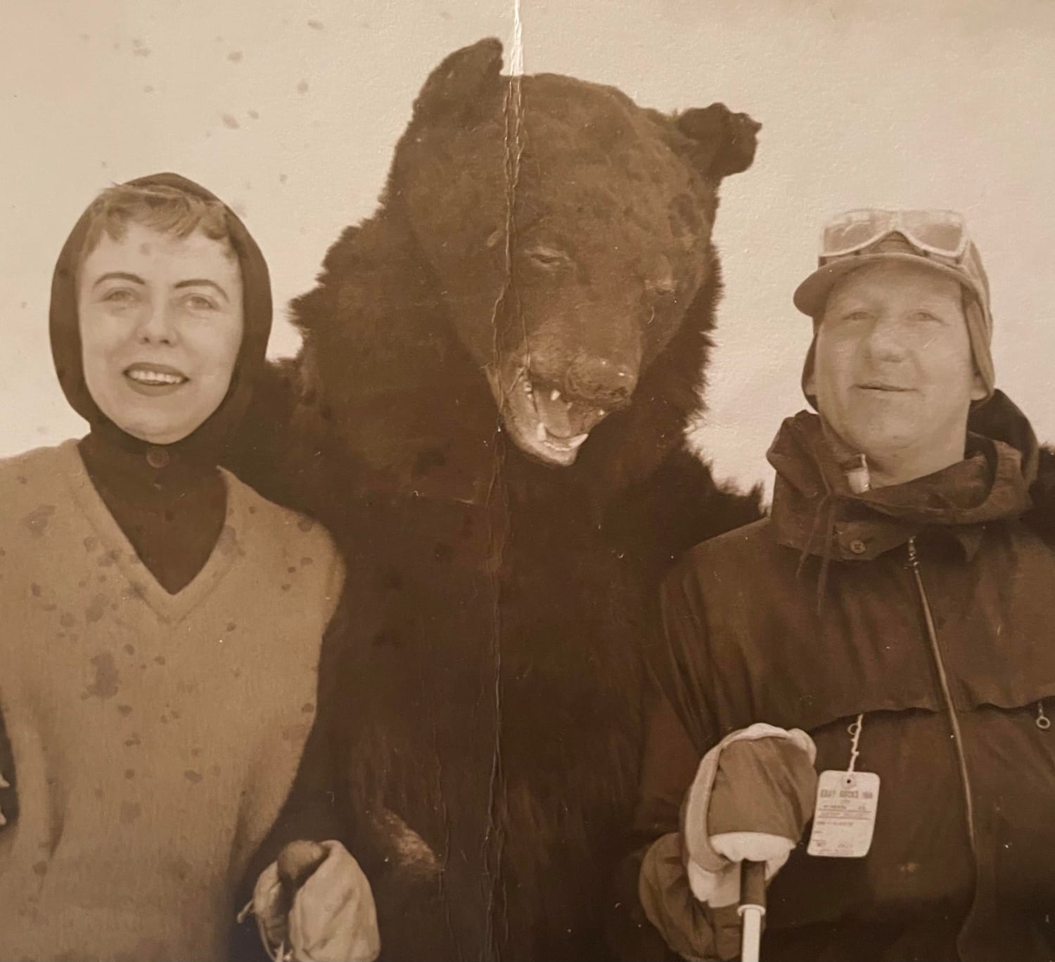 My grandfather in Austria (I believe) skiing with someone in a horrible taxidermy bear suit (1960s)